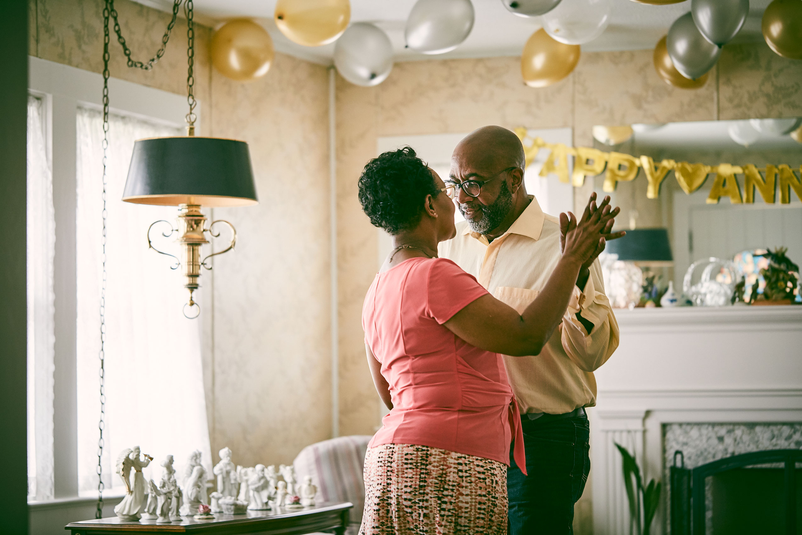 An older couple dance in their living room celebrating their anniversary shot for Blue Cross/Blue Shield.