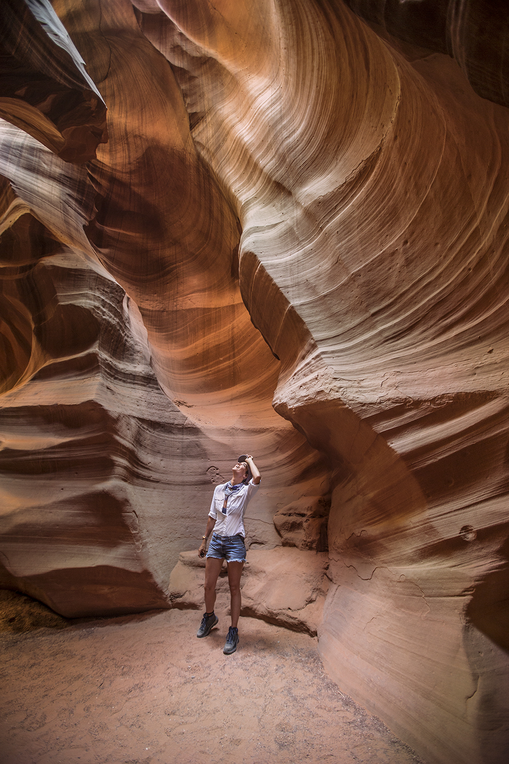 Woman walking through Antelope Canyon, Arizona.