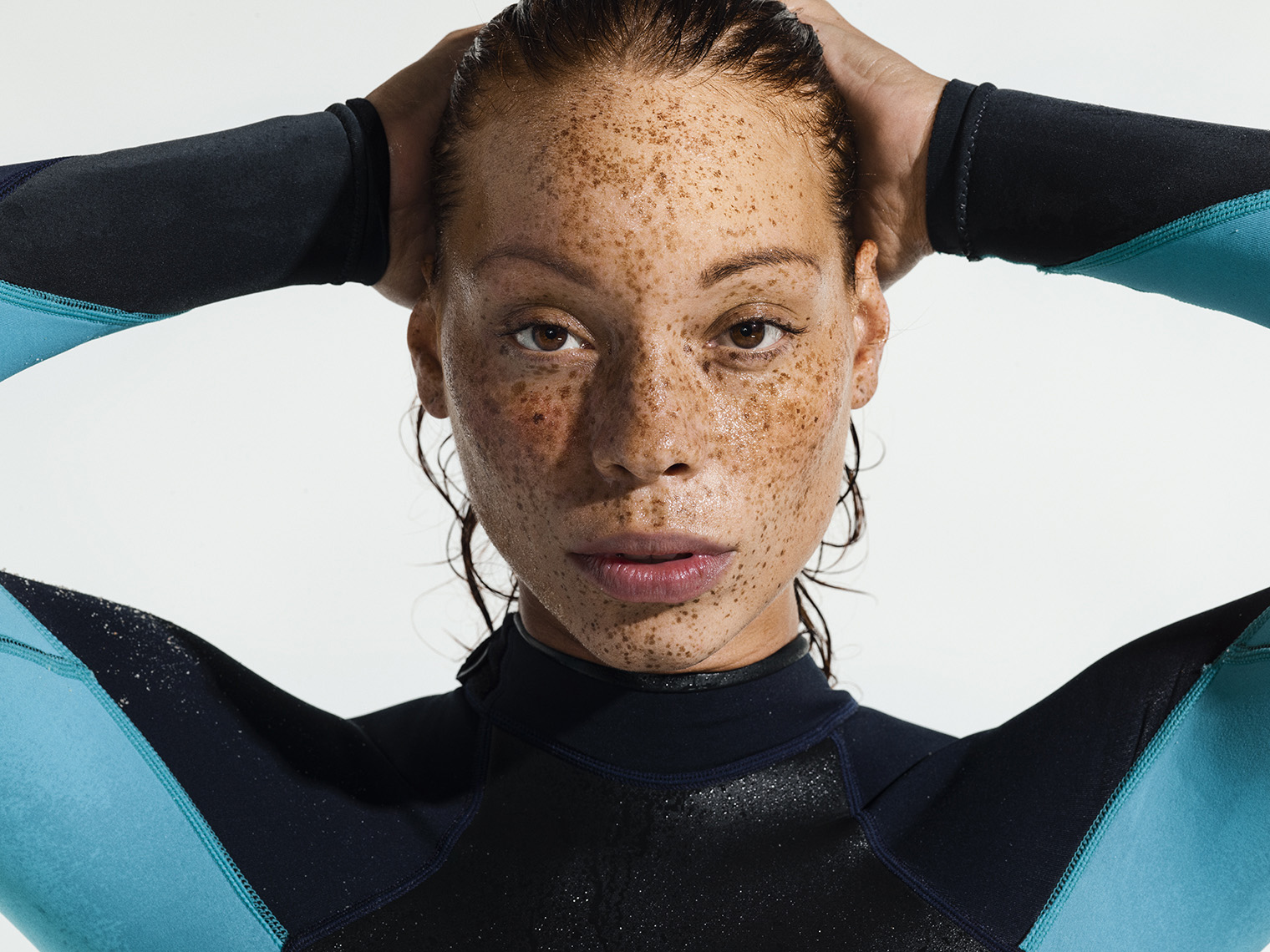Female model poses as a surfer for a campaign for flooring company COREtec.