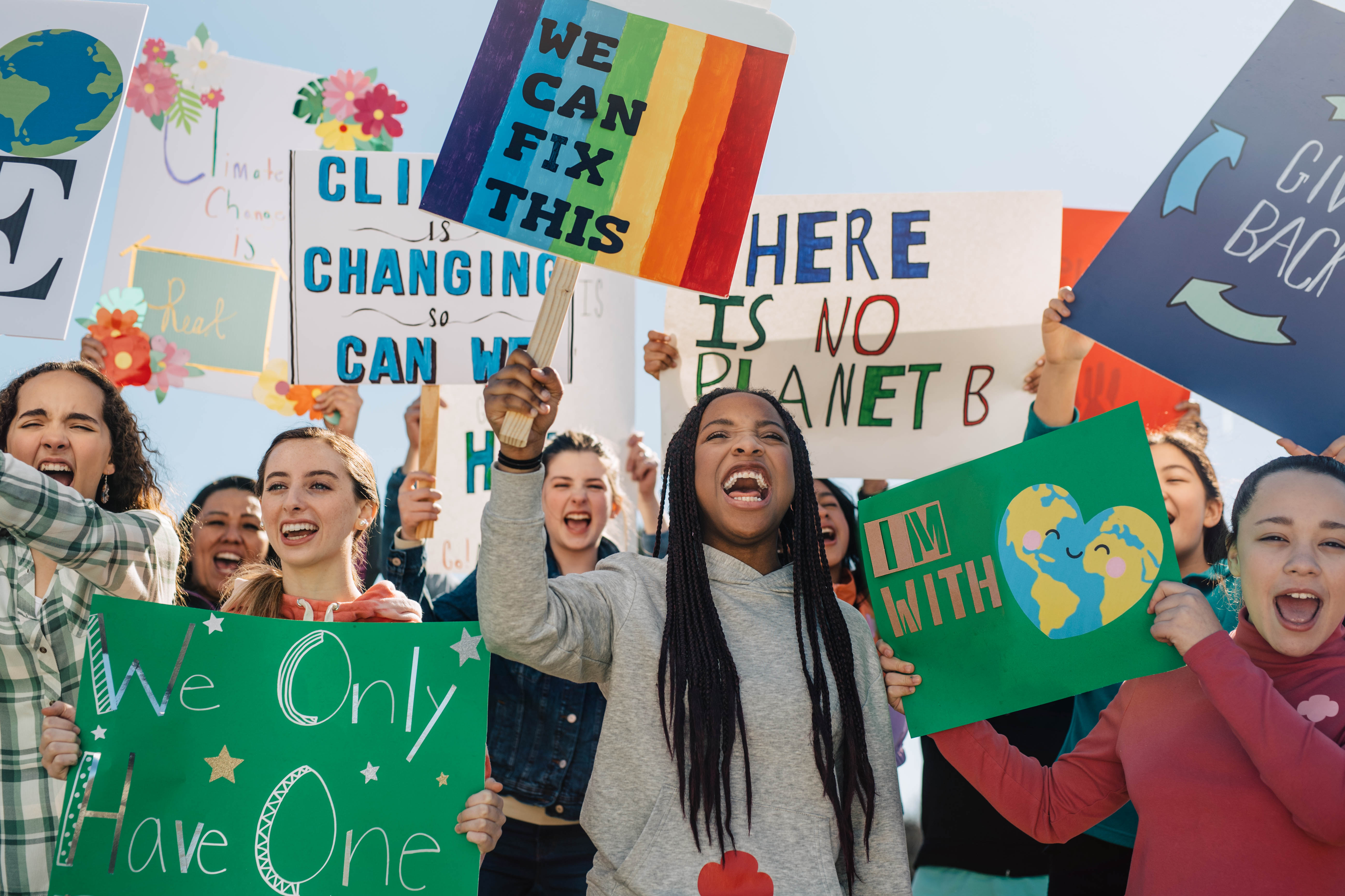 A group of young women protesting global warming. Client: Girl Scouts 