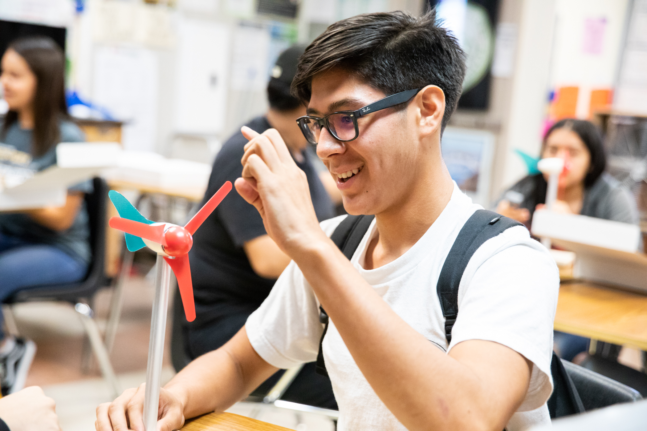Teenage boy in science class with technology.