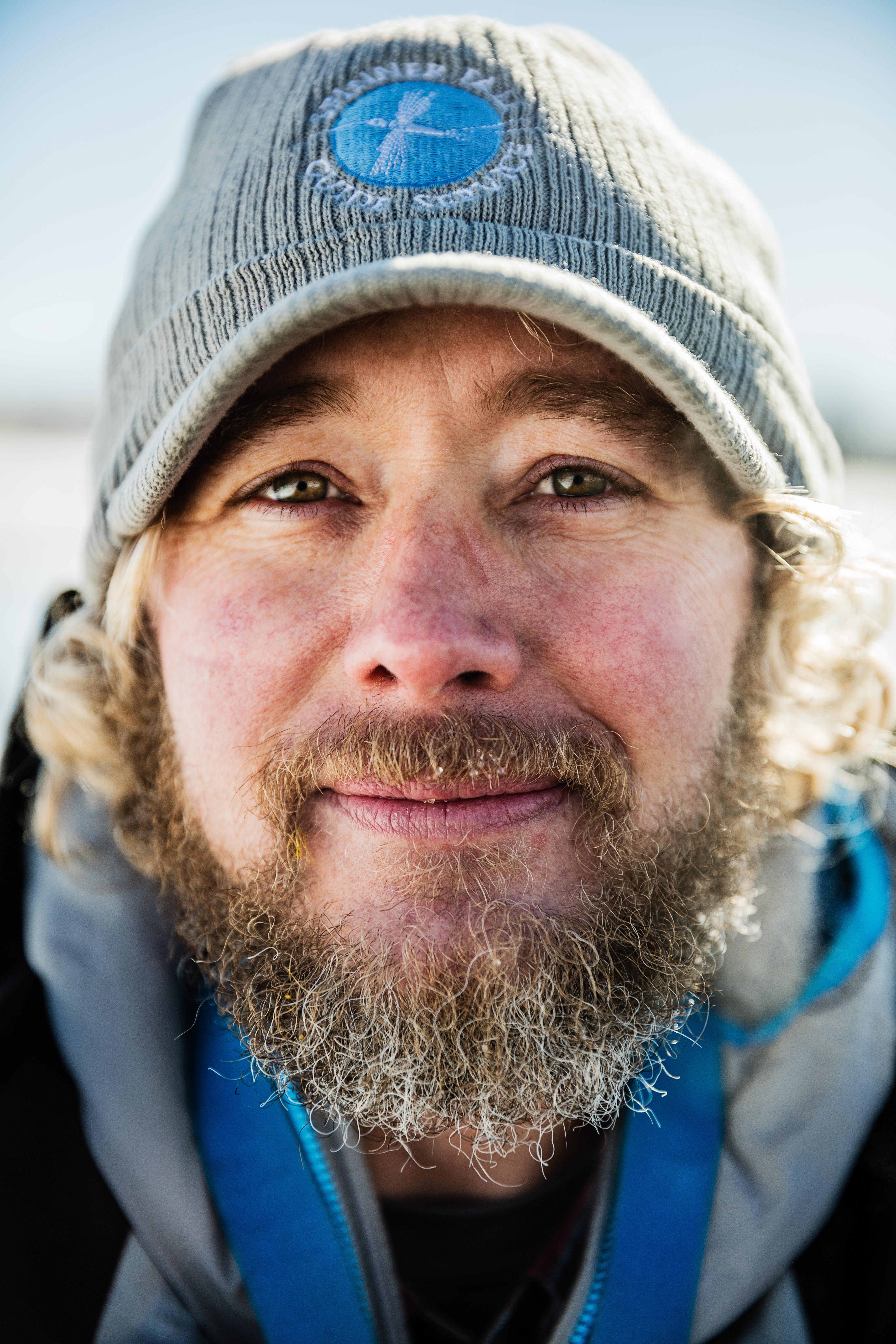 Outdoor portrait of a bearded man.