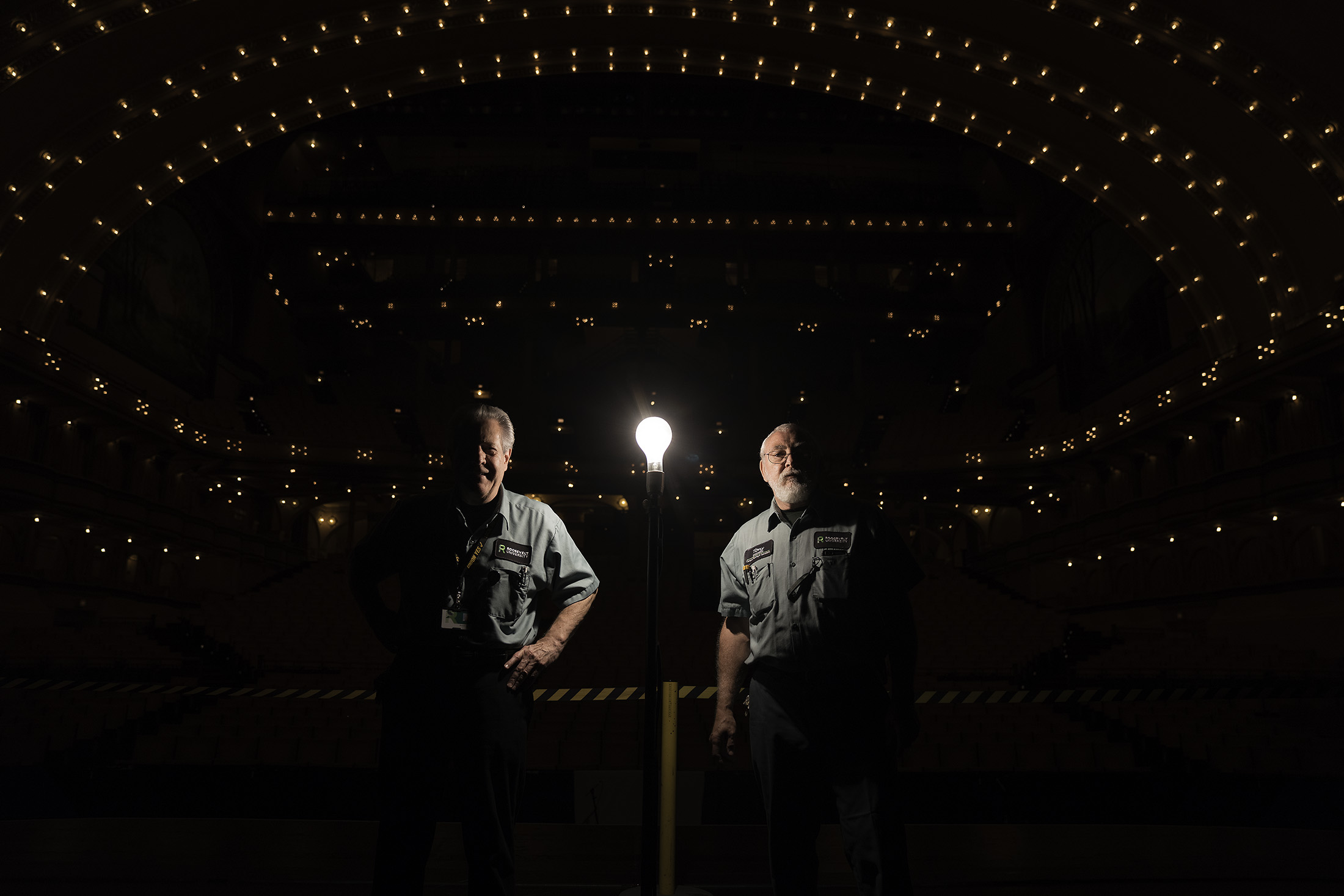 Maintenance workers on the stage of the Auditorium theater in Chicago.