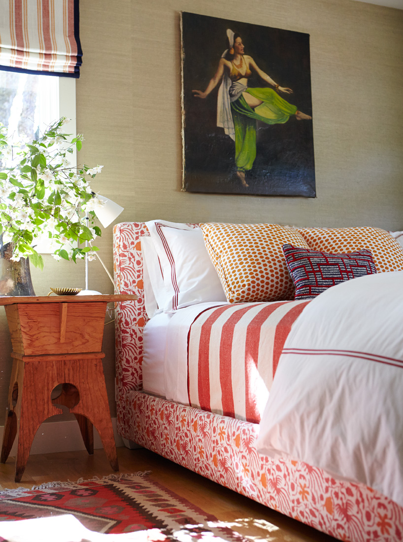 Bedroom, bright orange color bed frame and fun bedding. 