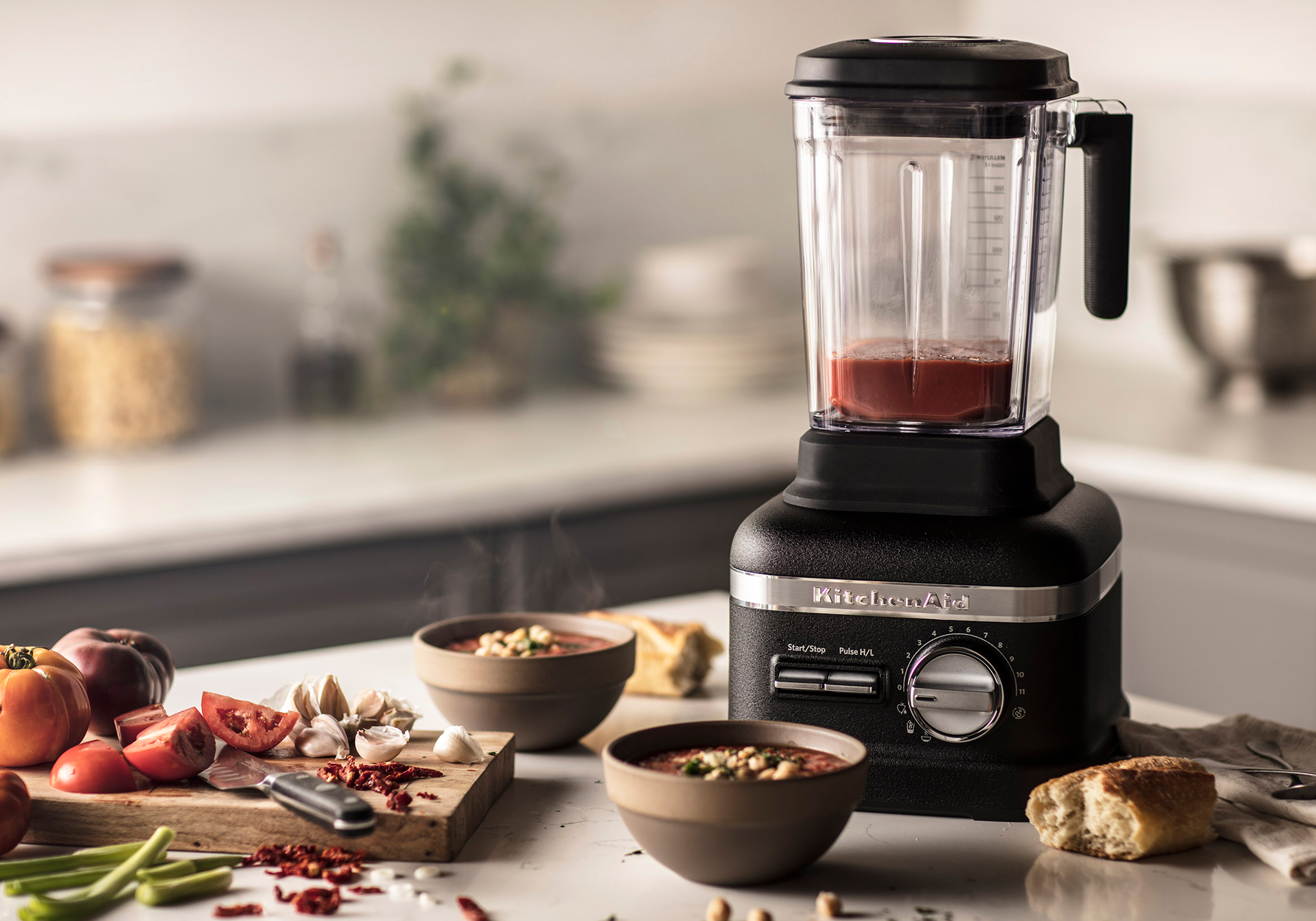 Tomato soup being prepped in a kitchen aid blender