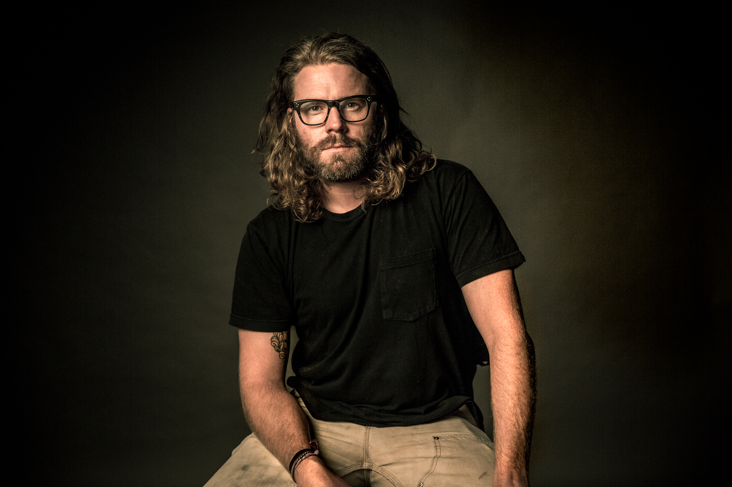 Man with long hair, beard and moustache wearing casual work clothes. Shot for 'Movember', Detroit, Michigan
