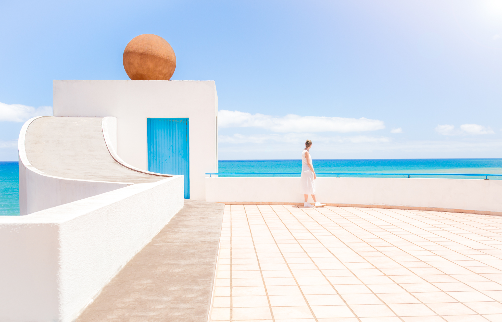 American traveller gazes out at the Atlantic Ocean from the island of Madeira.