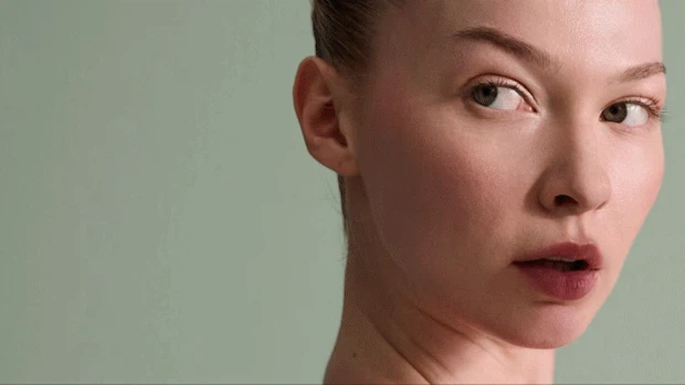 A studio photo shoot of models showcasing New Balance activewear. 