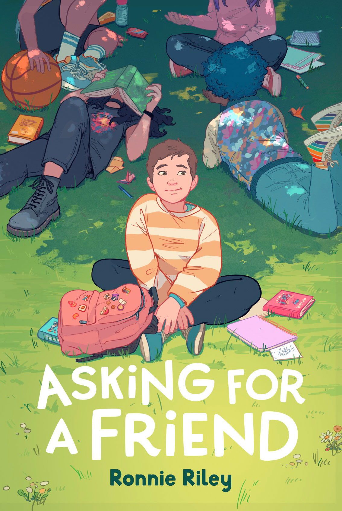 A young boy in a striped sweater sits on the grass among friends, surrounded by books and a basketball. Some kids are lying down, reading, and others are engaged in conversation.